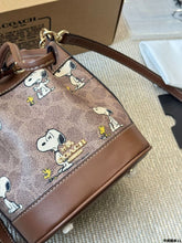 Load image into Gallery viewer, Coach X Peanuts Mini Dempsey Bucket Bag in signature canvas