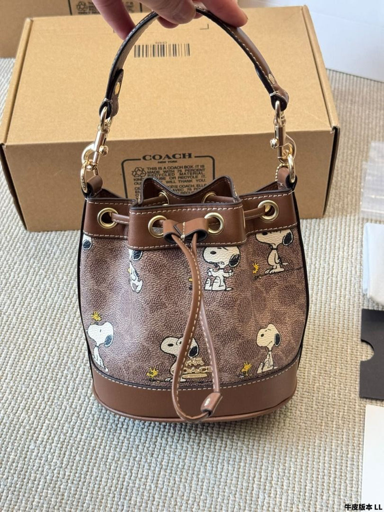Coach X Peanuts Mini Dempsey Bucket Bag in signature canvas