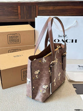 Load image into Gallery viewer, Coach x Peanuts Mollie Tote 25 in signature canvas with a Snoopy print