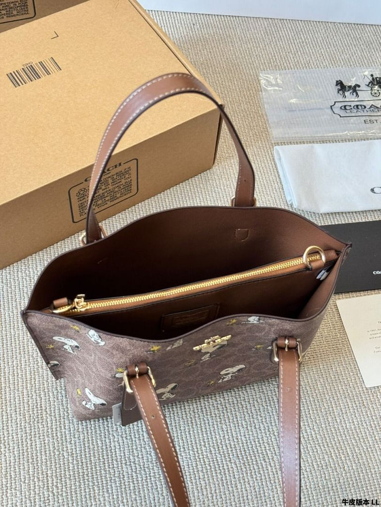 Coach x Peanuts Mollie Tote 25 in signature canvas with a Snoopy print