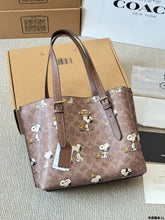 Load image into Gallery viewer, Coach x Peanuts Mollie Tote 25 in signature canvas with a Snoopy print