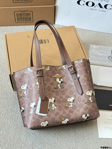 Coach x Peanuts Mollie Tote 25 in signature canvas with a Snoopy print