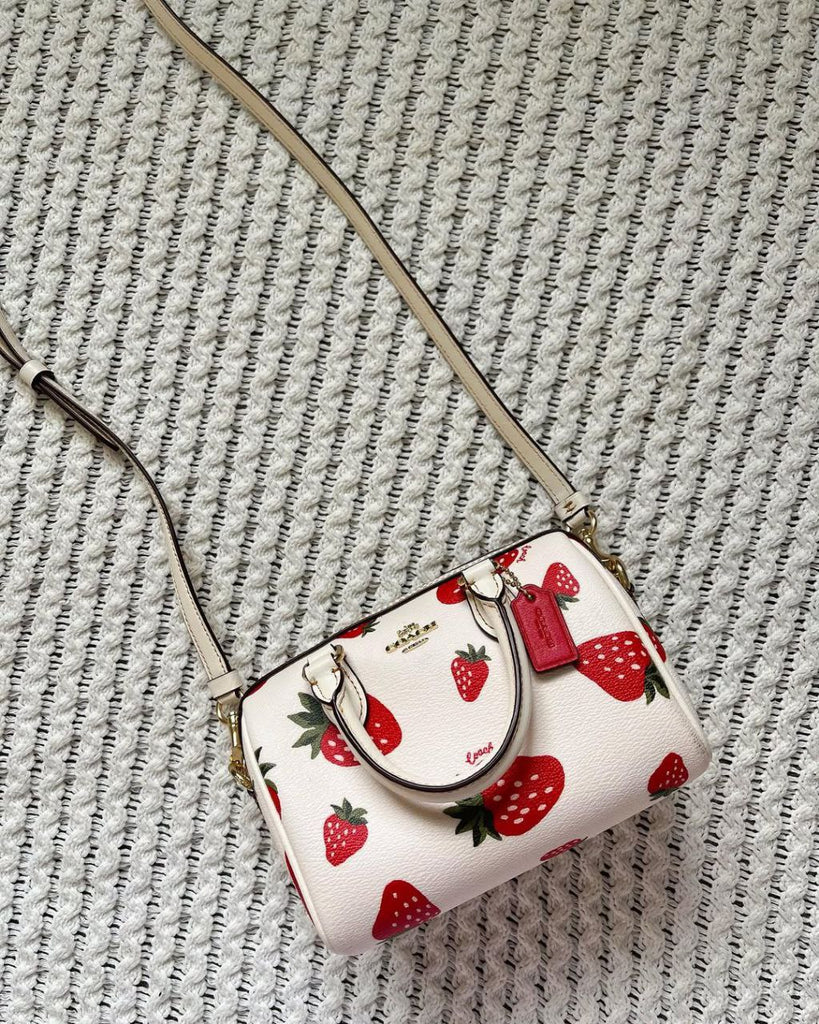 Coach Mini Rowan Crossbody bag with a wild strawberry print