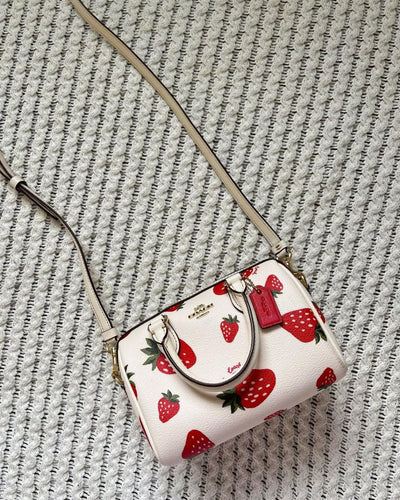 Coach Mini Rowan Crossbody bag with a wild strawberry print