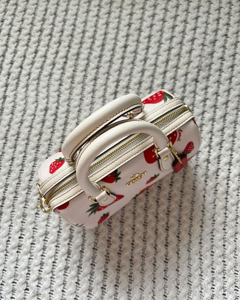 Coach Mini Rowan Crossbody bag with a wild strawberry print