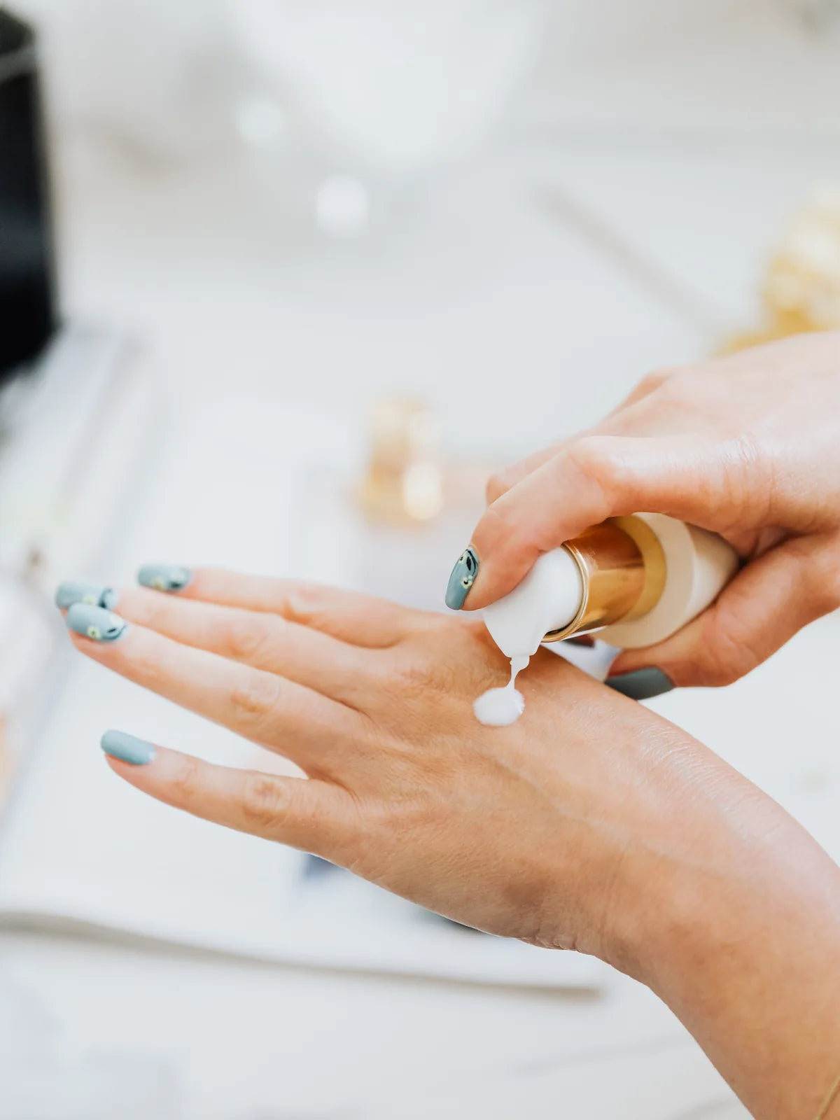 Close-up of moisturizer dispensed onto the back of a hand